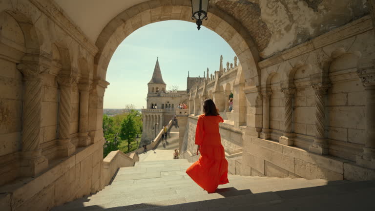 Woman exploring a historic European castle